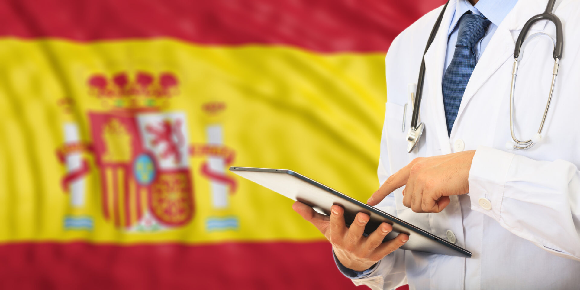 Doctor with tablet and Spanish flag